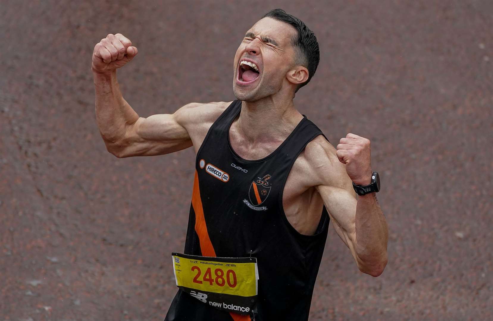 Runner Karl Nolan shows his delight at crossing the finishing line in 2023. Image: TCS London Marathon.